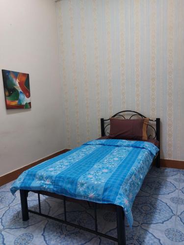 Ένα ή περισσότερα κρεβάτια σε δωμάτιο στο Mabuhay Guest House, Thai Embassy Vientiane