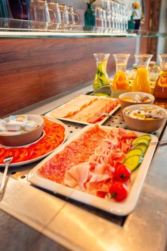 a buffet with many different types of food on a table at Aspria Hamburg Uhlenhorst Sport & Spa in Hamburg