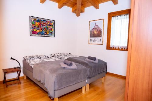 a bedroom with a bed in a room at Residence Stradella Verde in Staranzano