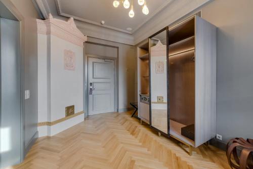 a hallway with a dressing room and a door at Grand Poet Hotel and SPA by Semarah in Riga