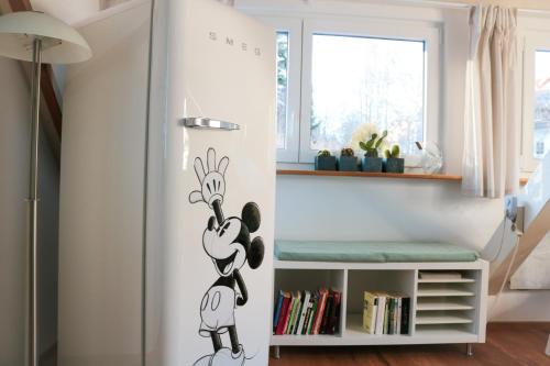 a room with a mickey mouse decal on the wall at Wolfsgrund Villa und/oder Apartment - Luxus in Seenähe mit tollem Garten in Schluchsee
