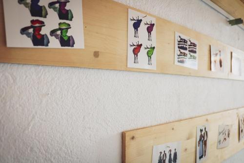 a wall with pictures of animals on it at Wolfsgrund Villa und/oder Apartment - Luxus in Seenähe mit tollem Garten in Schluchsee