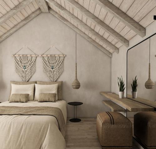 een slaapkamer met een bed en een tafel bij CHC Sound of the Sea in Karpathos