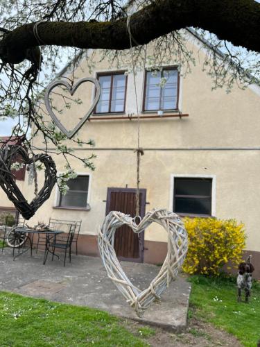 a heart swing in front of a house at Möschbauerhof Nähe Redbullring in Sankt Marein bei Knittelfeld