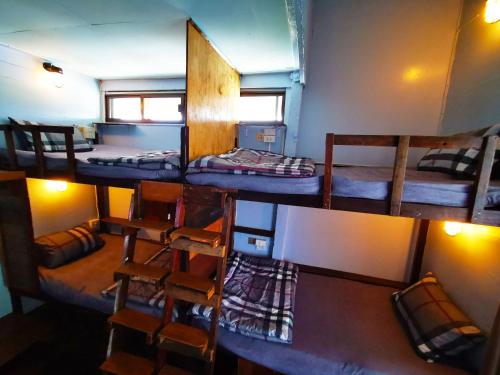 a group of bunk beds in a room at The Lodge Kanchanaburi in Ban Chuk Kum
