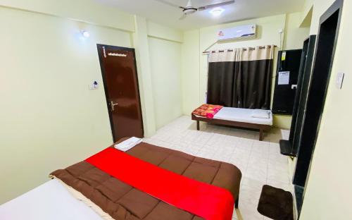 Tempat tidur dalam kamar di Hotel Uday Palace