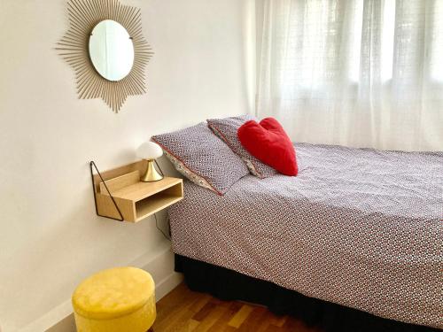 Ένα ή περισσότερα κρεβάτια σε δωμάτιο στο Appartement familial avec terrasse et parking