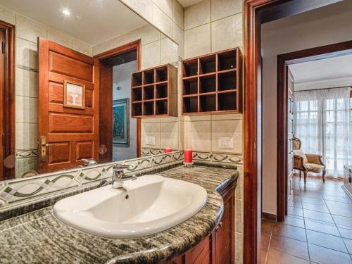 a bathroom with a white sink in a room at Bungalow Fairway Village in Golf del Sur in San Miguel de Abona