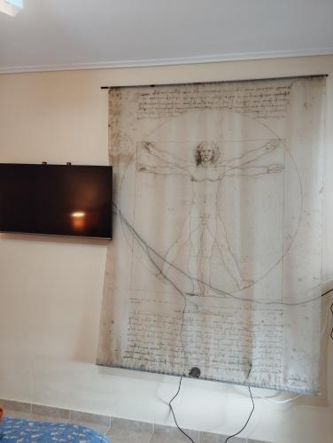 a drawing of a man on a wall at Dancer's Home in Korinthos