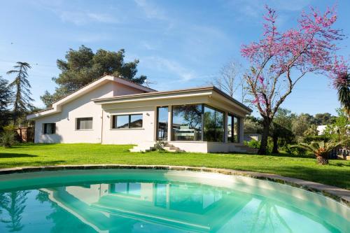 a house with a swimming pool in front of a house at ALFA COUNTRY HOUSE Villa Salento in Lequile