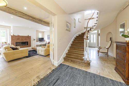 a living room with a staircase and a living room at Maison familiale au cœur des vignes 