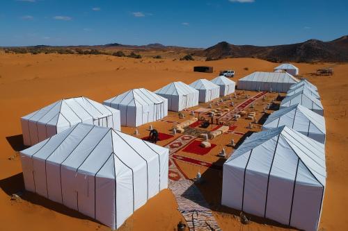 an aerial view of a compound in the desert at Erg Chebbi Desert Luxury Camp in Merzouga