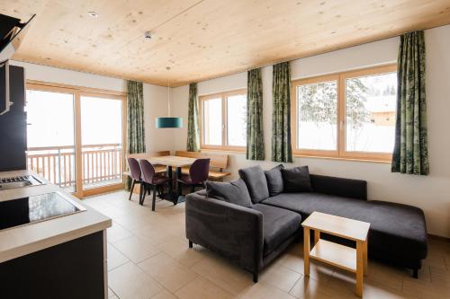 a living room with a couch and a table at Lisas Schröcken in Schröcken