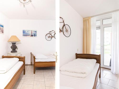 a bedroom with a bed and a bike on the wall at Residence Juliana 68 in Julianadorp