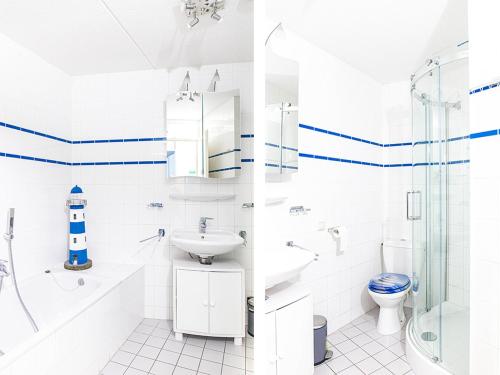 two pictures of a bathroom with a lighthouse on the wall at Residence Juliana 68 in Julianadorp