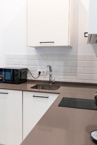 Una cocina o zona de cocina en Resolana Suites