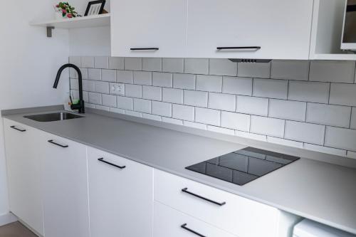 Una cocina o zona de cocina en Resolana Suites