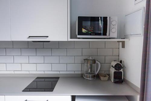 Una cocina o zona de cocina en Resolana Suites