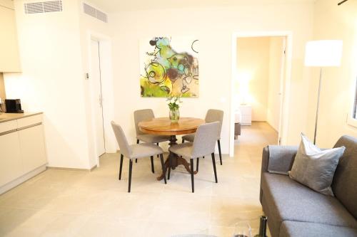 a dining room with a table and chairs at Casa QUATTRO FIUMI in Tegna