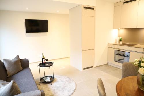 a living room with a couch and a table at Casa QUATTRO FIUMI in Tegna