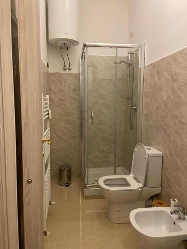 a bathroom with a shower and a toilet and a sink at Poesia di Lerici in Lerici