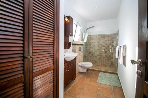 a bathroom with a toilet and a sink at Villa Olympos Ladiko in Kalithies
