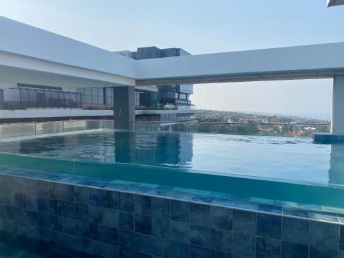 a swimming pool on the roof of a building at Coastlands Skye Hotel, Ridgeside, Umhlanga in Durban