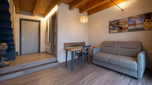 a living room with a couch and a table at Il Viaggio Impresa Sociale in Bicchignano