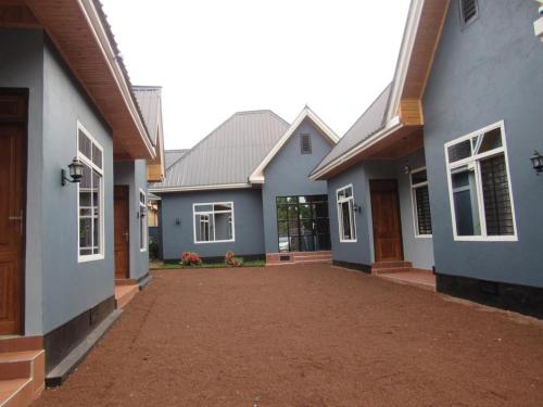 a house with a driveway in front of it at Moshi Epic Accommodation in Moshi
