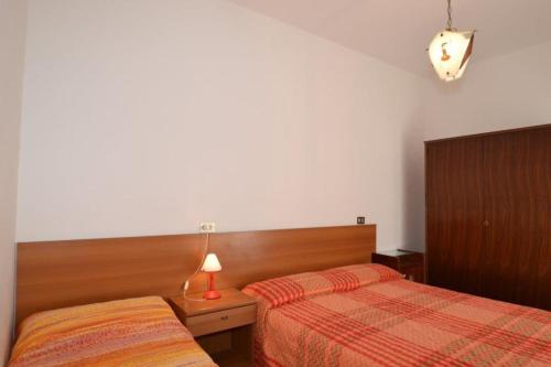 A bed or beds in a room at Annarosa