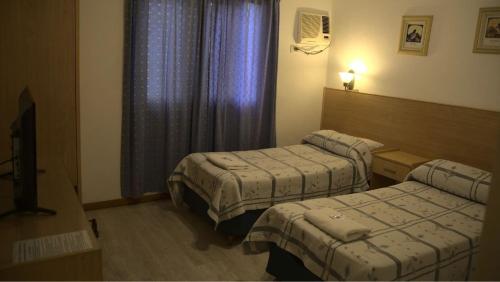 Posteľ alebo postele v izbe v ubytovaní Aires Express