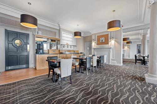 a dining room with a table and chairs at Royal Whitby in Whitby