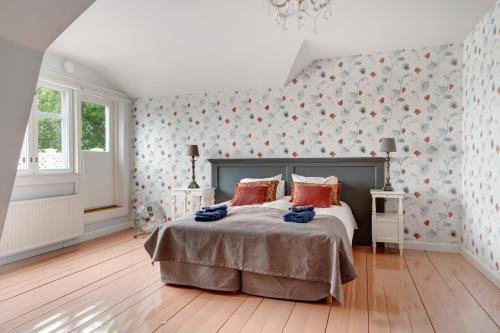 a bedroom with a bed and a wall with hearts at Villa Wolax in Kaarina