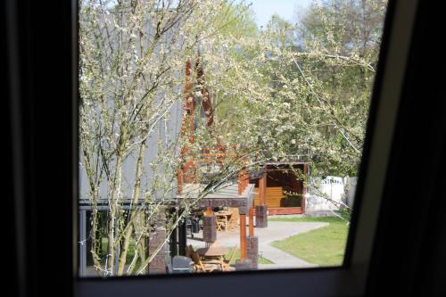 a view of a building from a window at Valea Mosului - Cozy A Frame in Petroşani