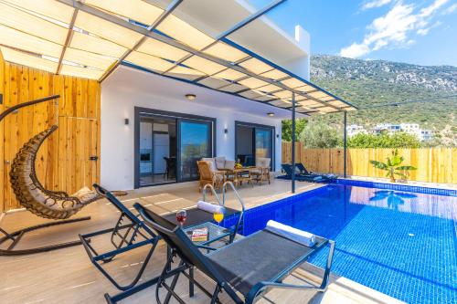 a villa with a swimming pool and a house at Albedo Villa in Kas