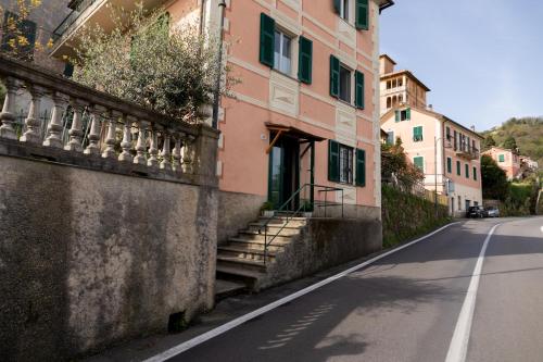 an empty street with a building with stairs on the side at Posa in Santa Margherita Ligure