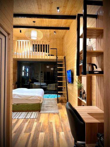 a bedroom with a bunk bed and a desk at The Kiana's in Mussoorie