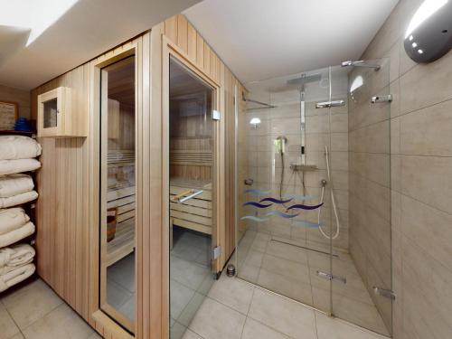 a bathroom with a walk in shower and a glass shower stall at Dom nad Morzem Pleśna78 in Pleśna