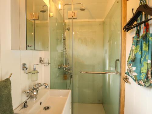 a bathroom with a glass shower and a sink at Portland in Retford