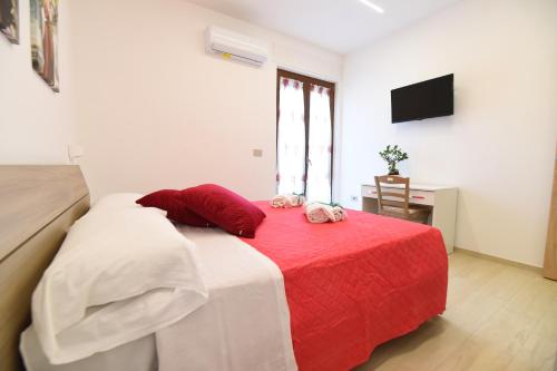 Ένα ή περισσότερα κρεβάτια σε δωμάτιο στο Acunto's Homes