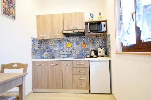Η κουζίνα ή μικρή κουζίνα στο Acunto's Homes