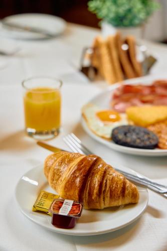 two plates of breakfast food on a table at The Briar Court Hotel in Huddersfield