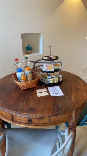 a wooden table with food on top of it at Ca'Gialla in Bellinzona