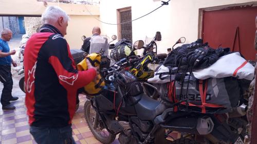 a man standing next to a group of motorcycles at Maison d'Hôte Valentine in Tinerhir