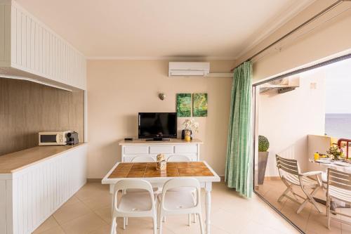 Beachfront 1 BDR Apartment With Pool by LovelyStay