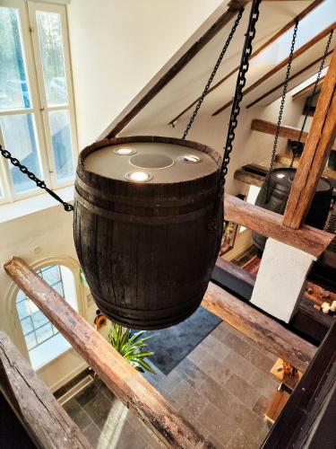 a large wooden barrel hanging from the ceiling at Hotel 1622 - Spa, Hotell & Konferens in Helsingborg