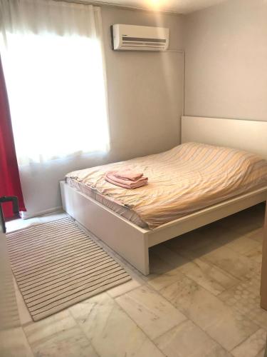 מיטה או מיטות בחדר ב-Apartment City center alsancak
