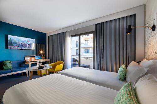 Letto o letti in una camera di Nemea Appart Hotel Cannes Palais