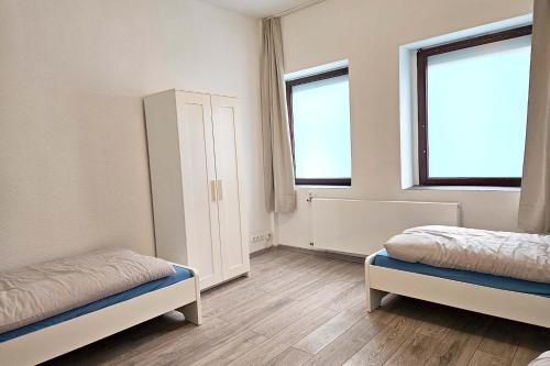 Gulta vai gultas numurā naktsmītnē Work & Stay Apartment in Leverkusen