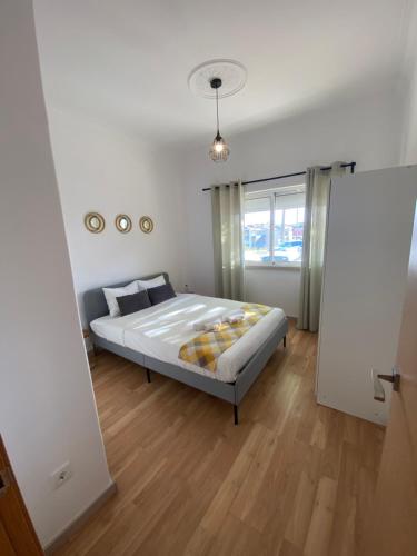 Voodi või voodid majutusasutuse Almada Central Apartment toas